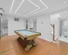 Rec room with sink, light wood-type flooring, and billiards