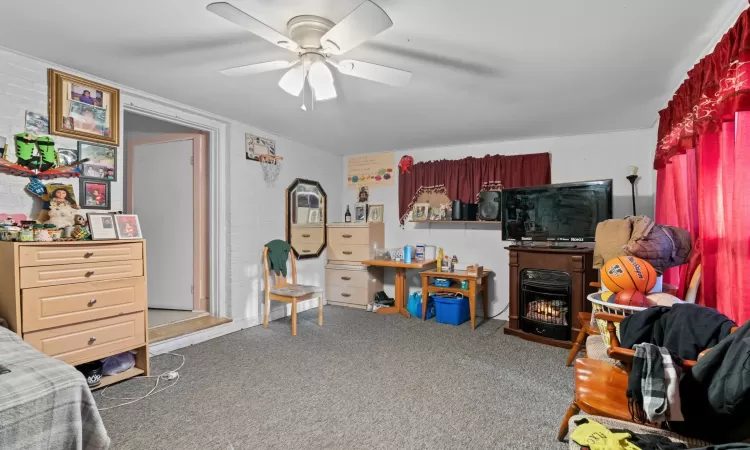 Bedroom with carpet flooring and ceiling fan