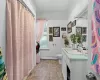 Bathroom featuring baseboard heating, vanity, and toilet