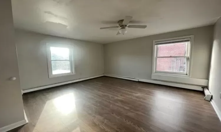 Living Room, freshly painted with new flooring.