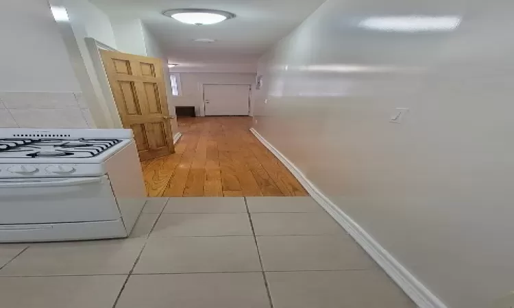 Corridor featuring hardwood / wood-style floors