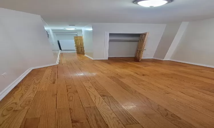 Hall featuring light hardwood / wood-style flooring