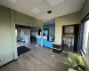 Kitchen with hardwood / wood-style floors, a drop ceiling, and a healthy amount of sunlight