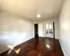 Unfurnished room featuring dark hardwood / wood-style floors and ornamental molding