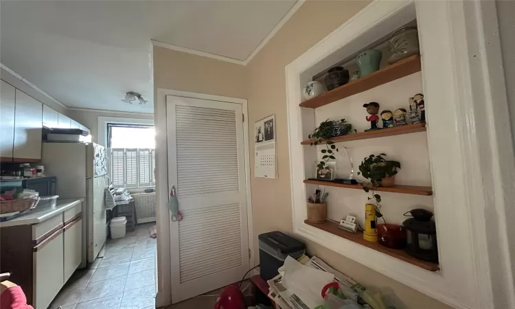 Full bathroom featuring toilet, backsplash, shower / tub combo with curtain, and tile walls