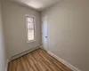 Spare room with light wood-type flooring and a baseboard radiator