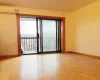 Unfurnished room featuring an AC wall unit and light hardwood / wood-style flooring