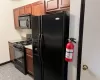 Kitchen featuring black appliances