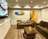 Living room featuring hardwood / wood-style floors and ornamental molding