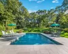 View of pool with a yard and a patio