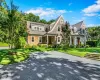 Cape cod home with a front lawn