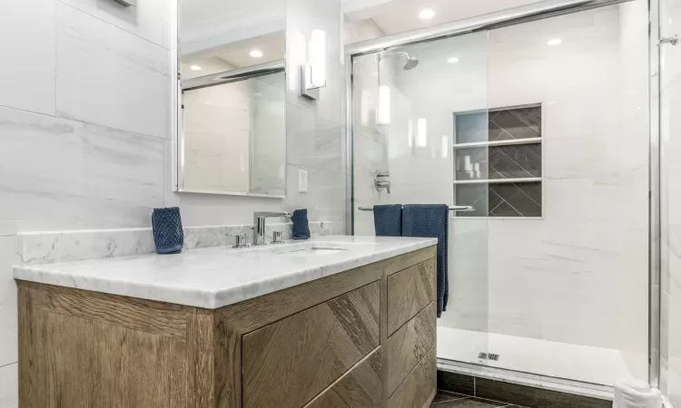 Bathroom featuring vanity and walk in shower