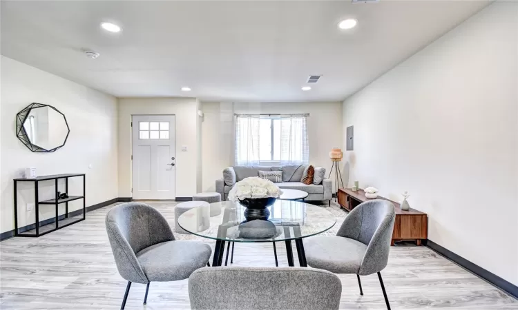 Dining room with light hardwood / wood-style floors