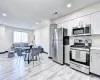 Kitchen with light wood-type flooring and stainless steel appliances