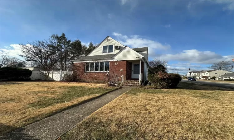 Front facade featuring a front lawn