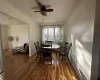 Dining area featuring ceiling fan, hardwood / wood-style floors, and ornamental molding