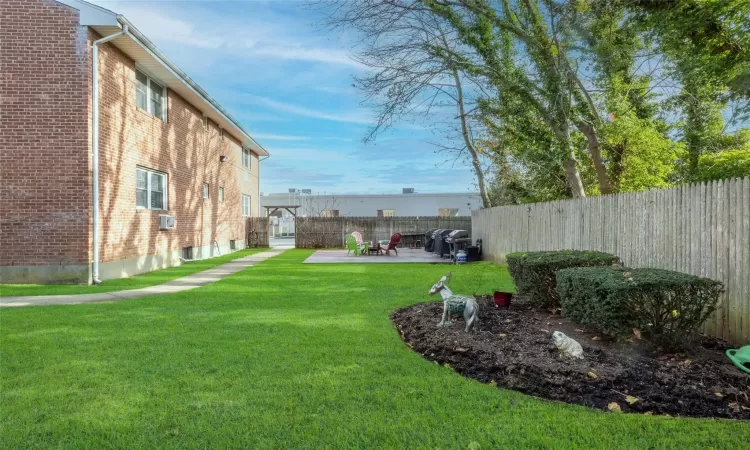 View of yard with a patio