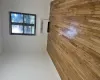 Unfurnished room featuring light hardwood / wood-style floors and radiator