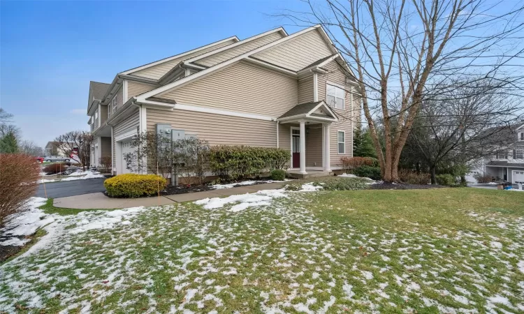 Back of property with a patio area and a yard