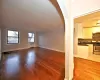 Unfurnished living room featuring light hardwood / wood-style floors and sink