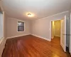 Unfurnished room with ornamental molding and hardwood / wood-style flooring