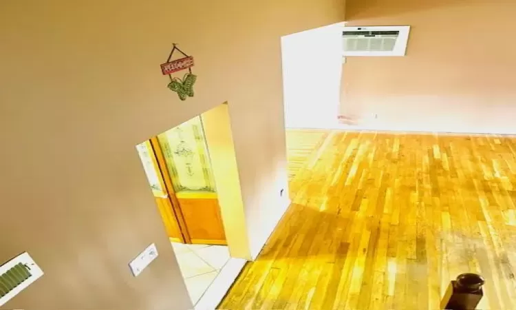 Hallway with hardwood  flooring