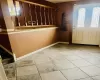 Tiled foyer featuring a wealth of natural light