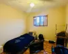 Bedroom featuring hardwood flooring and ceiling fan