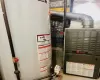 Utility room featuring gas water heater