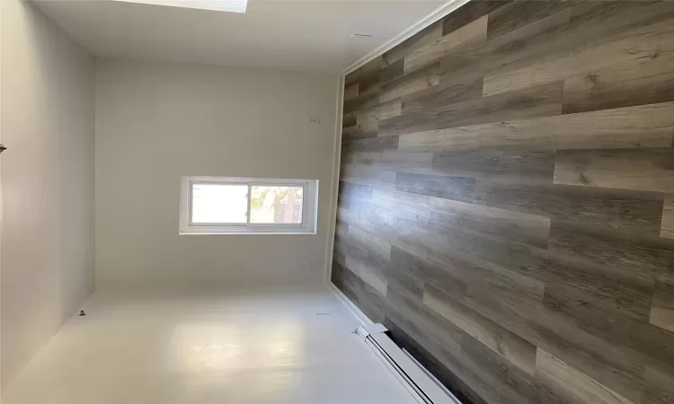 Unfurnished room featuring dark hardwood / wood-style floors