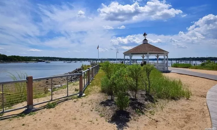 View of community featuring a gazebo and a water view