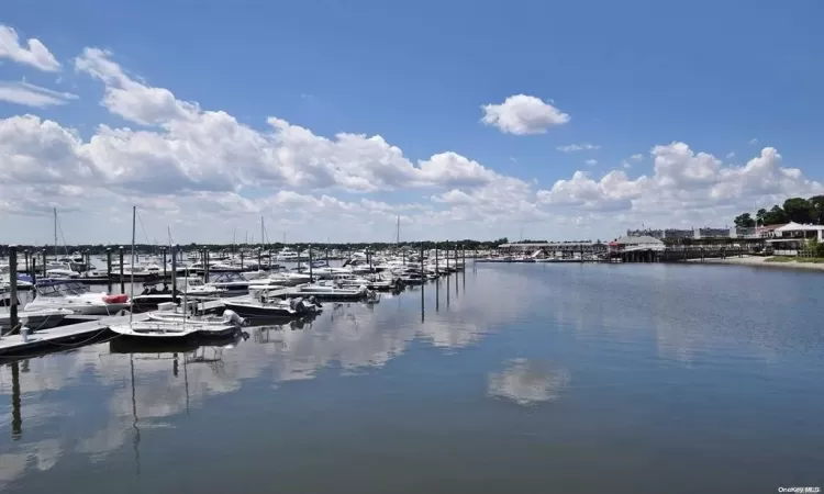 Property view of water with a dock