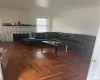 Living room featuring dark parquet floors and a fireplace