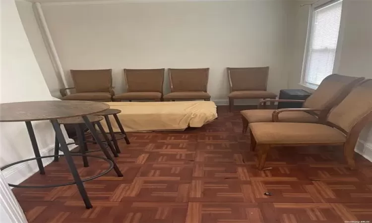 Living room featuring dark parquet floors