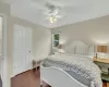 Bedroom with dark hardwood / wood-style floors and ceiling fan