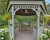 Wooden terrace featuring a gazebo