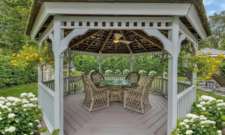 Wooden terrace featuring a gazebo