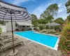 View of pool featuring a gazebo and a patio area