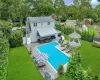 View of swimming pool featuring a gazebo, a patio area, a lawn, and an outdoor hangout area