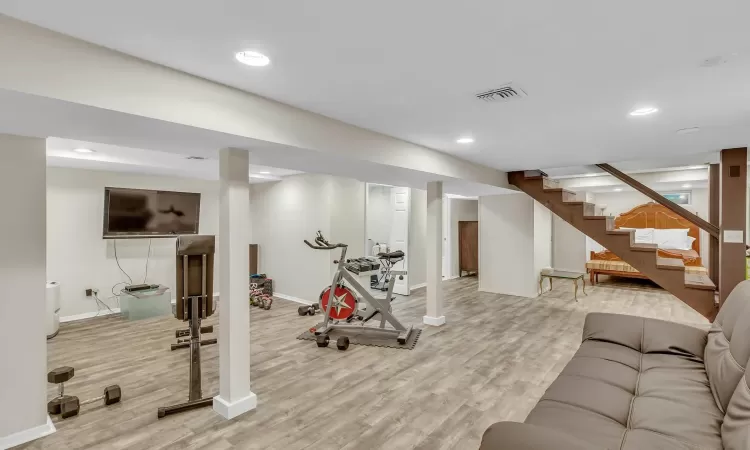 Exercise area featuring light hardwood / wood-style flooring