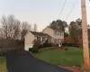 View of front of house with a lawn and a garage