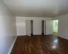 Unfurnished room with dark hardwood / wood-style floors