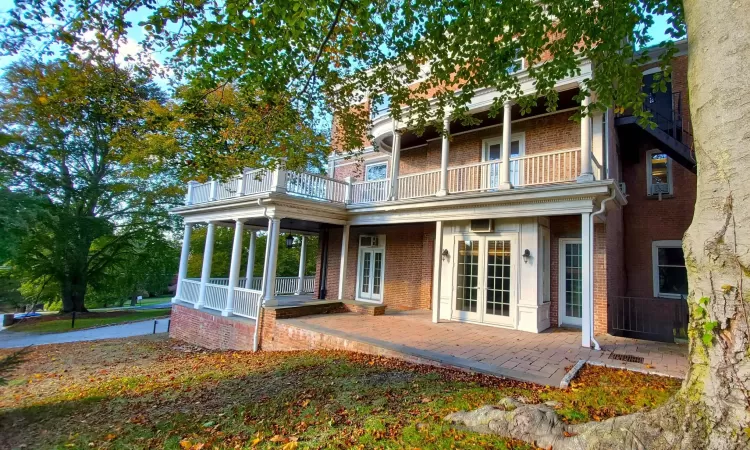 Side View featuring a balcony and french doors