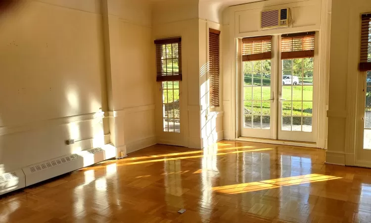 Entryway featuring light parquet flooring.