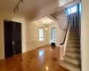 Entryway with parquet flooring, rail lighting, and plenty of natural light