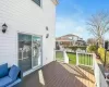 Wooden terrace featuring a yard