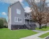 View of front facade featuring a porch and a front lawn