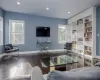 Living room with hardwood / wood-style flooring and plenty of natural light