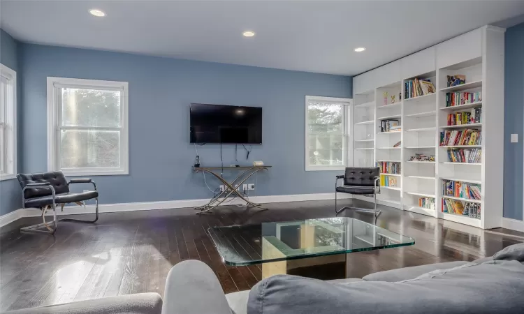 Living room with hardwood / wood-style flooring and plenty of natural light