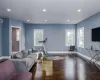 Living room featuring a wealth of natural light and dark hardwood / wood-style flooring